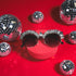 a pair of sunglasses sitting on top of a red box
